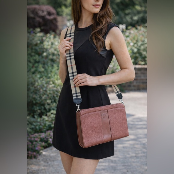 Burberry Handbags - Burberrys Clutch w/wrist strap EUC